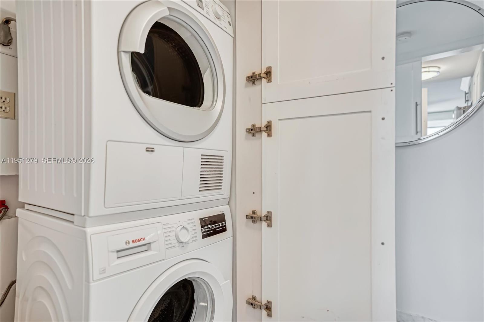 9341 Collins Avenue, Unit 201 Surfside, FL 33154 - Photo 27 of 34 a close up view of a washer and dryer