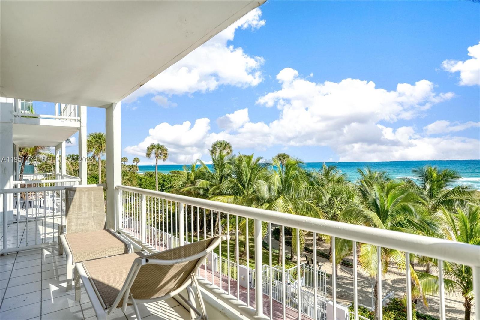 9341 Collins Avenue, Unit 201 Surfside, FL 33154 - Photo 5 of 34 a view of a chairs and table in patio