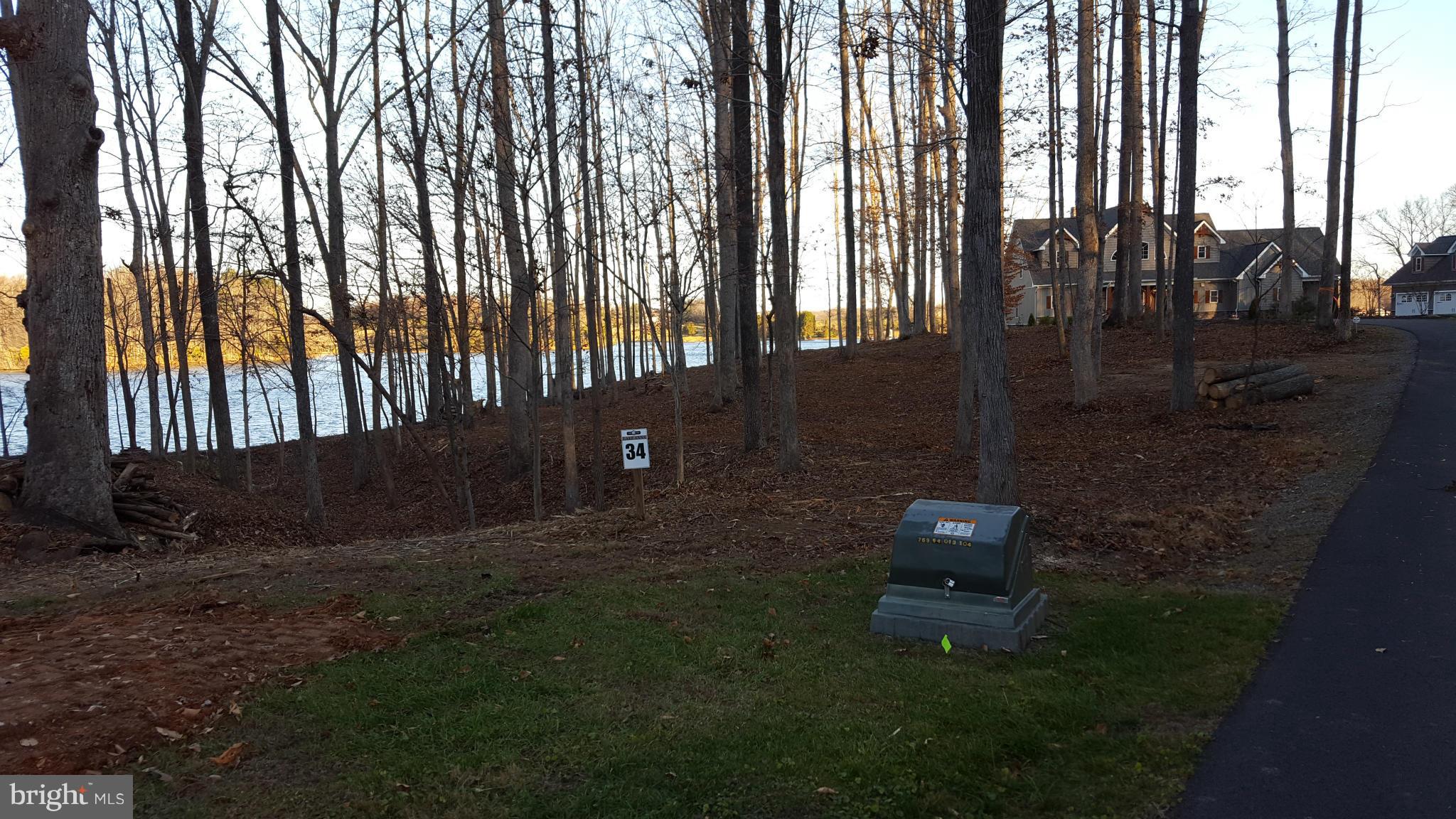 34 Boxwood Road Bumpass, VA 23024 - Photo 1 of 7 a backyard of a house with table and chairs