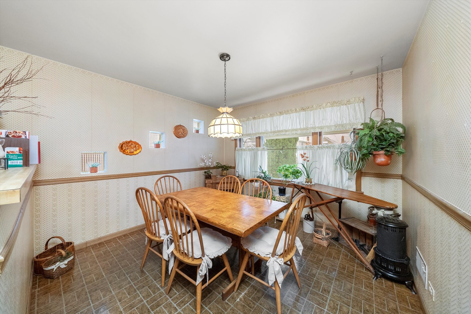 3915 West 64th Place Chicago, IL 60629 - Photo 13 of 34 a view of a dining room with furniture and chandelier