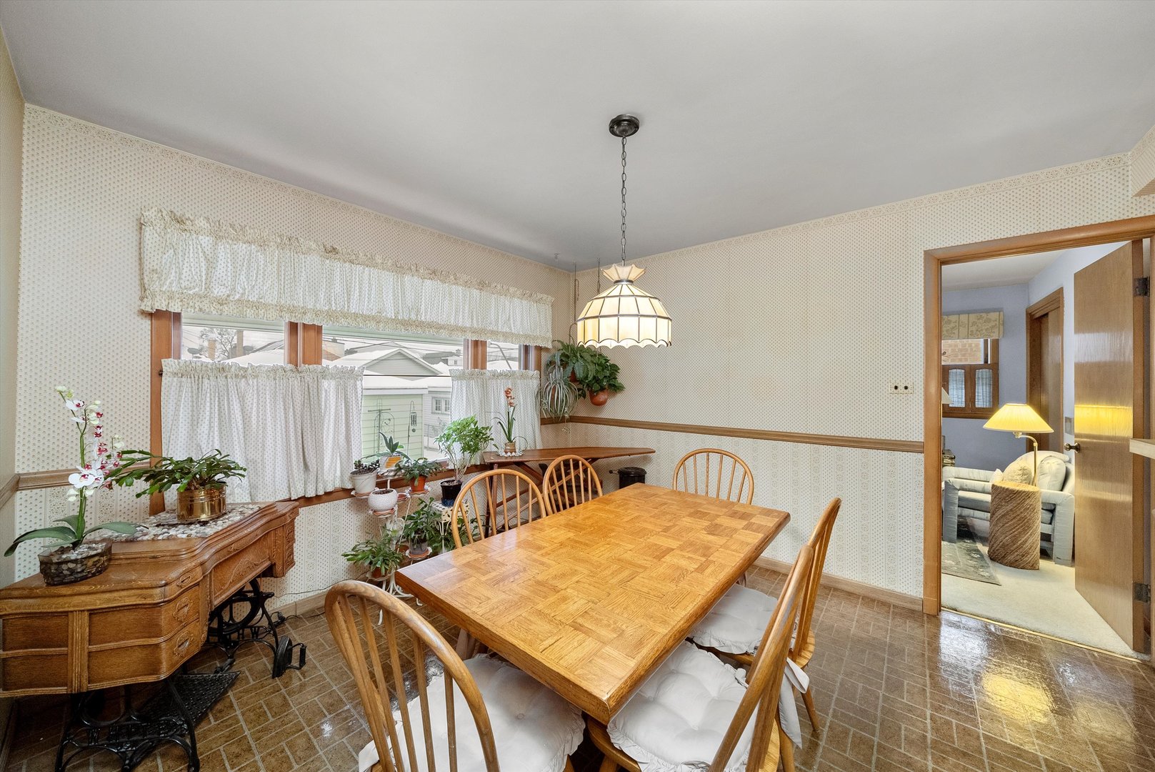 3915 West 64th Place Chicago, IL 60629 - Photo 14 of 34 a view of a dining room with furniture window and wooden floor