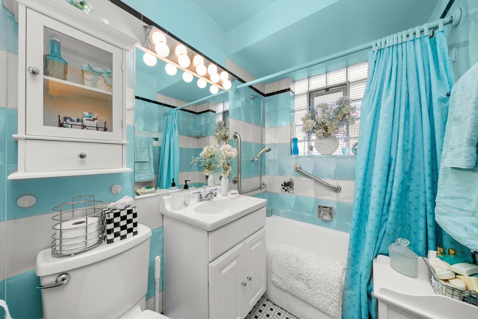 3915 West 64th Place Chicago, IL 60629 - Photo 7 of 34 a bathroom with a sink a toilet a mirror a vanity and shower