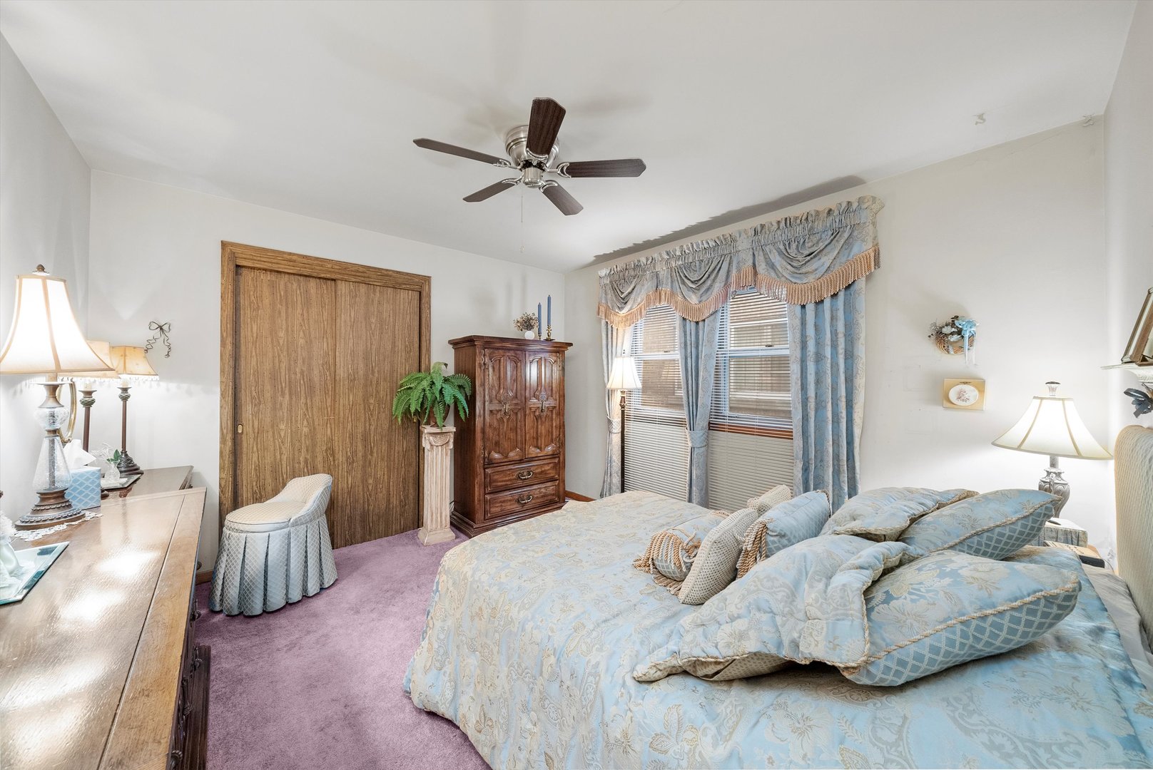 3915 West 64th Place Chicago, IL 60629 - Photo 8 of 34 a bedroom with a bed dresser and a large mirror