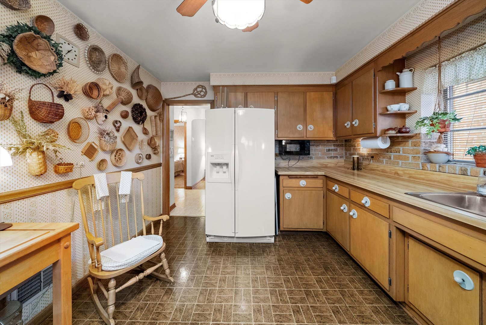 3915 West 64th Place Chicago, IL 60629 - Photo 10 of 34 a kitchen with a sink appliances and cabinets