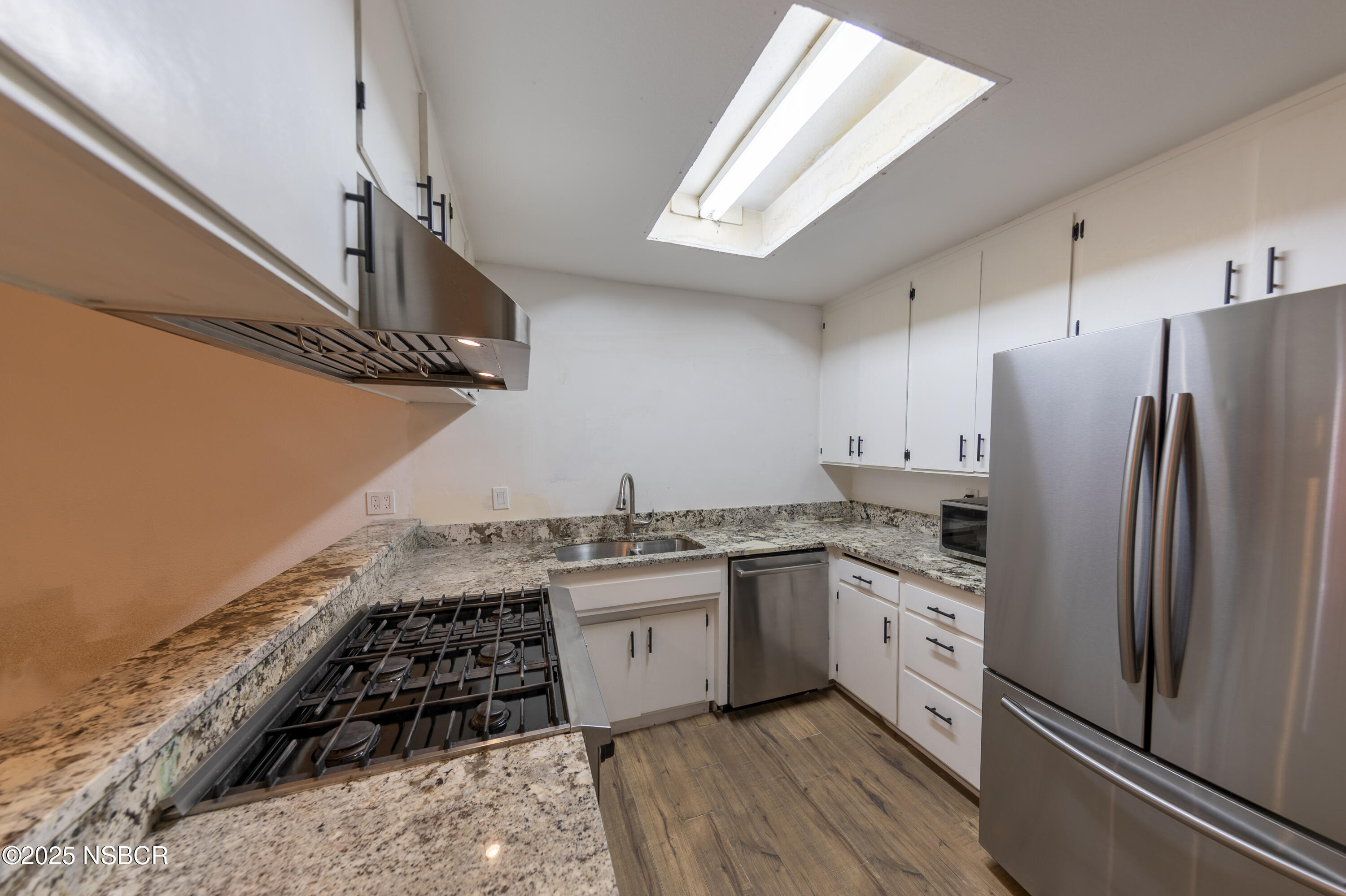 3118 Pellham Drive Lompoc, CA 93436 - Photo 27 of 56 a kitchen with stainless steel appliances granite countertop a stove a sink dishwasher and a refrigerator