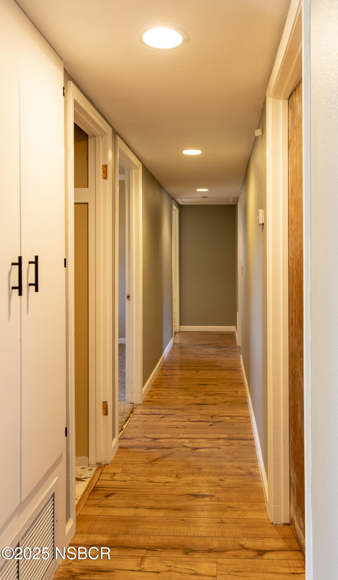 3118 Pellham Drive Lompoc, CA 93436 - Photo 33 of 56 a view of a hallway with wooden floor and a glass door