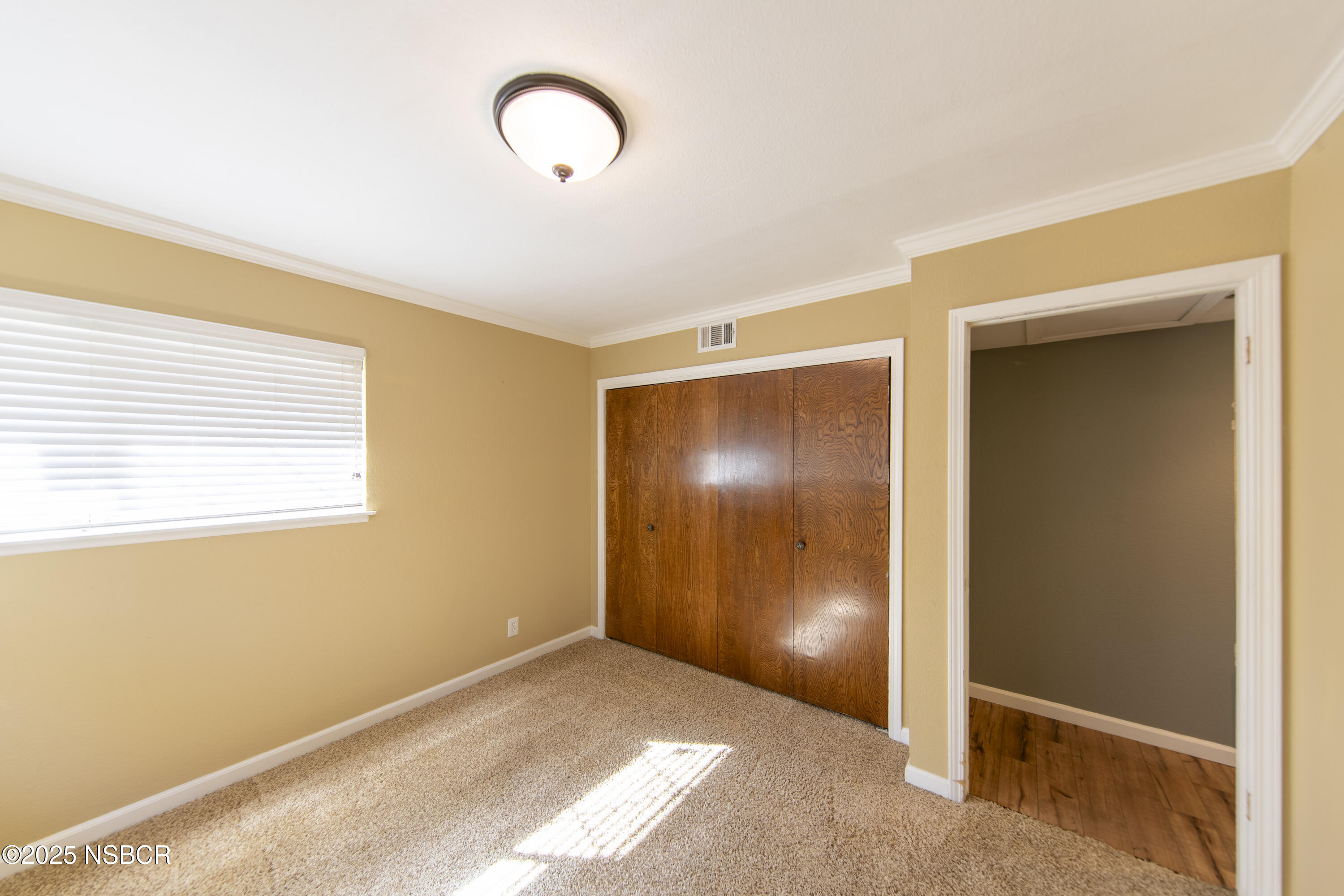 3118 Pellham Drive Lompoc, CA 93436 - Photo 46 of 56 a view of an empty room with window and wooden floor