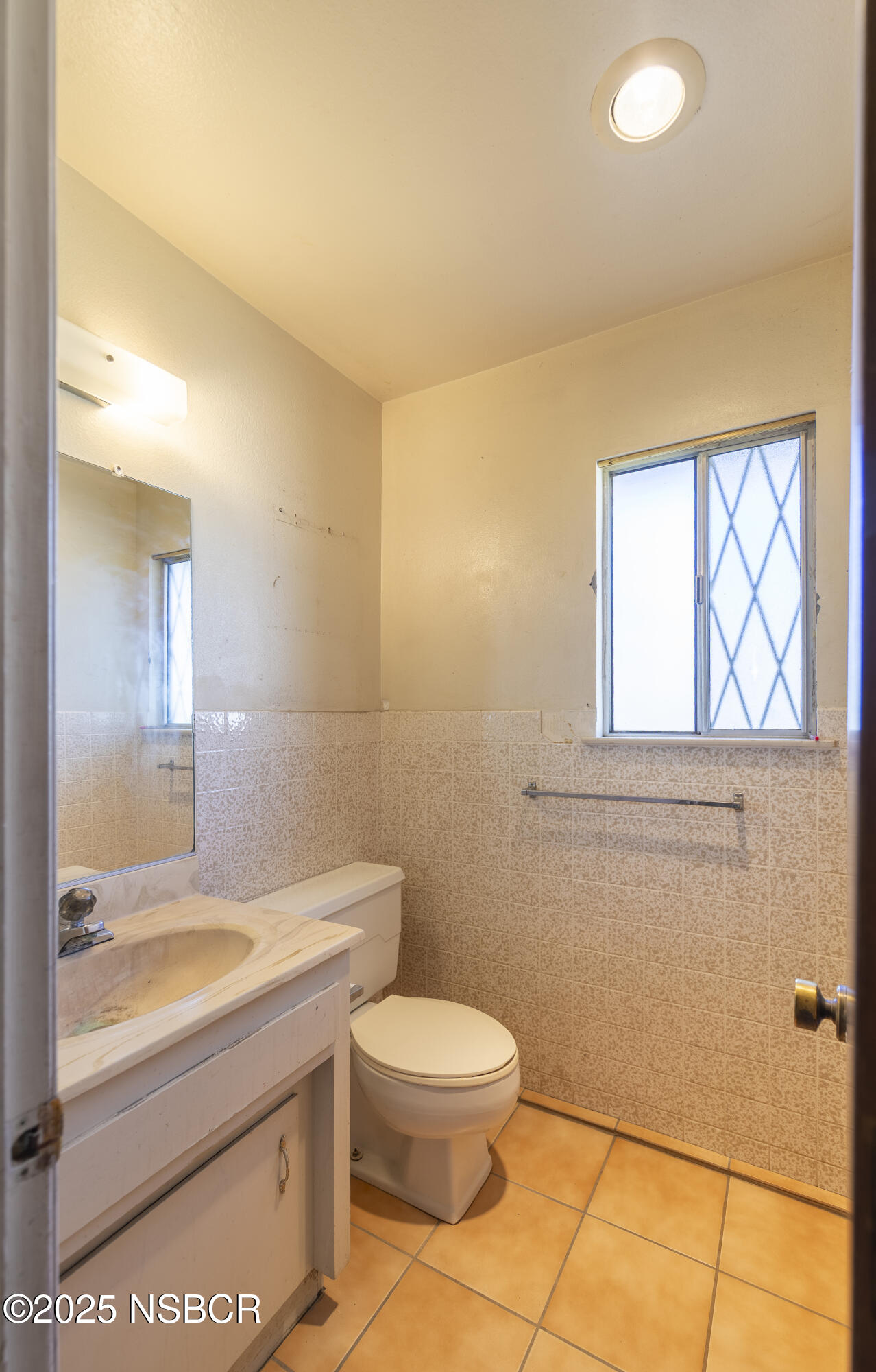 3118 Pellham Drive Lompoc, CA 93436 - Photo 52 of 56 a bathroom with a granite countertop sink a toilet and a mirror