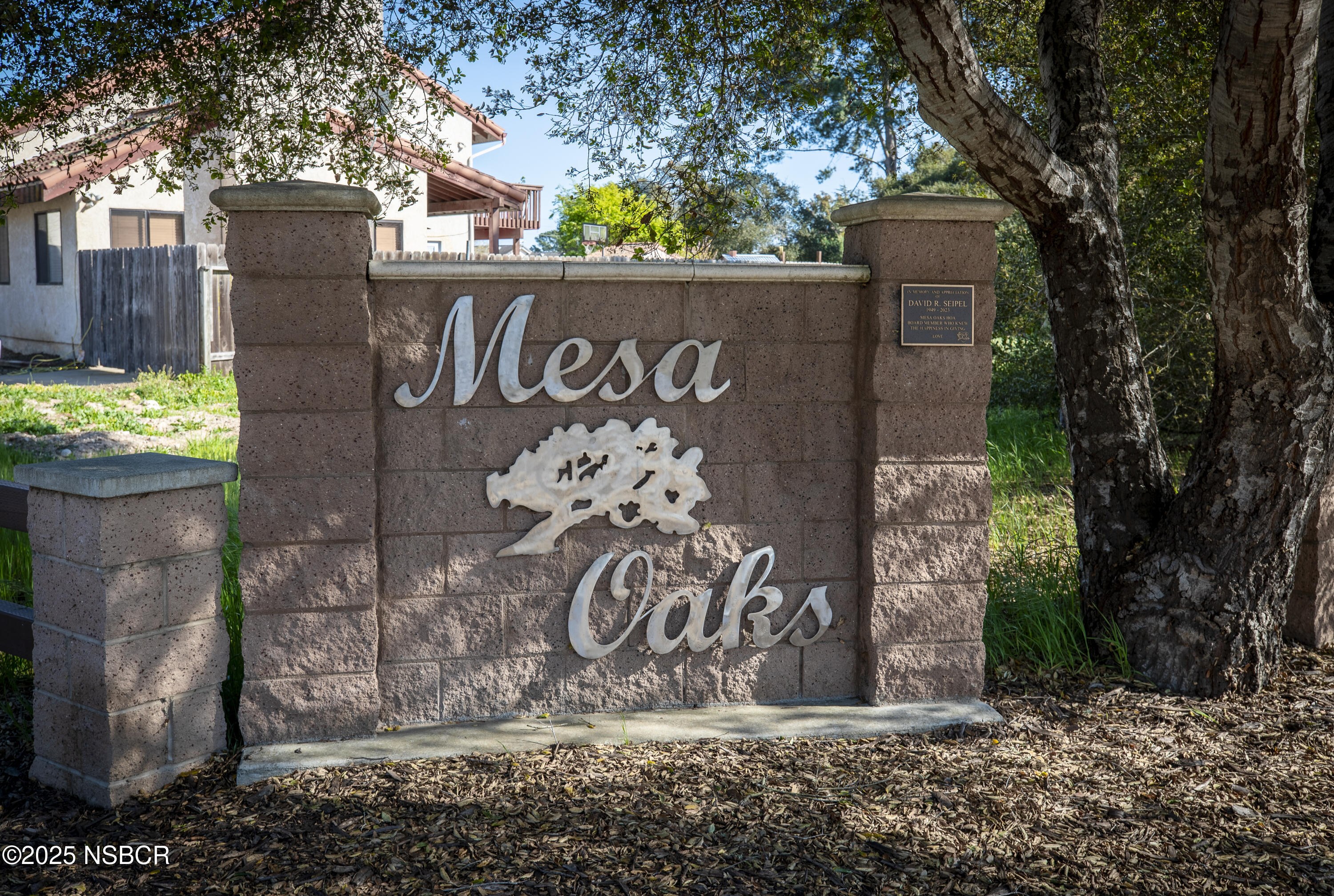 3118 Pellham Drive Lompoc, CA 93436 - Photo 56 of 56 a view of a street sign under a large tree