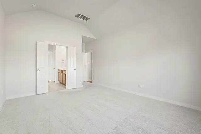 a bathroom with a tub sink shower and two mirror
