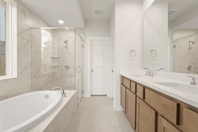 a bathroom with a tub and a shower