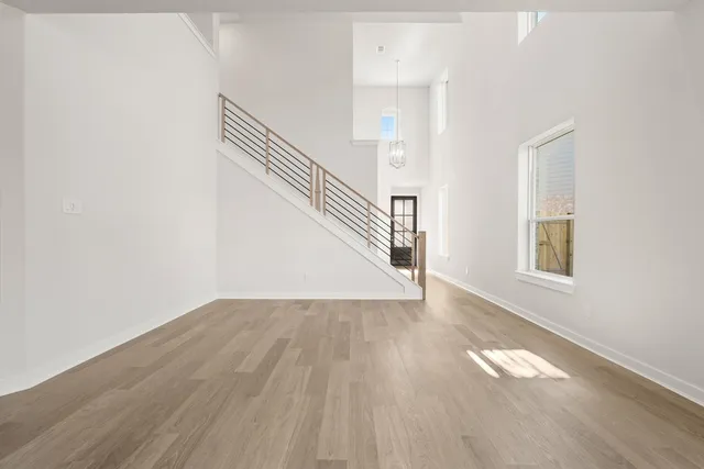 a view of an entryway with wooden floor