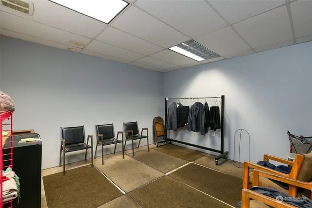 a workspace with furniture and a potted plant