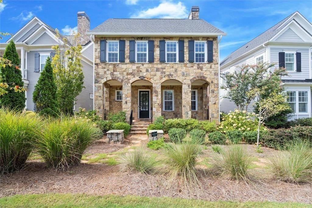 293 Thompson Street Alpharetta, GA 30009 - Photo 1 of 71 a front view of a house with a yard