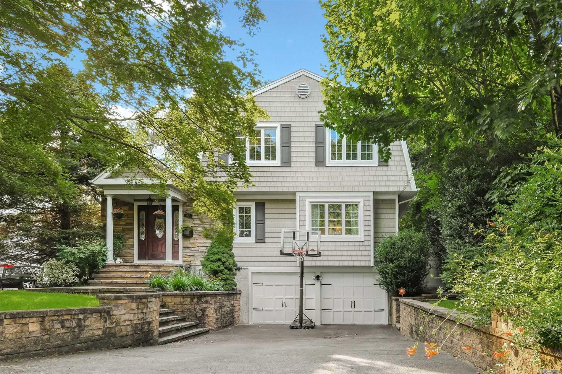 88 Meadowbrook Road Syosset, NY 11791 - Photo 1 of 1 front view of house with a yard