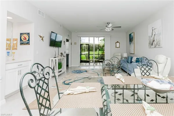 a view of a livingroom with furniture window and wooden floor