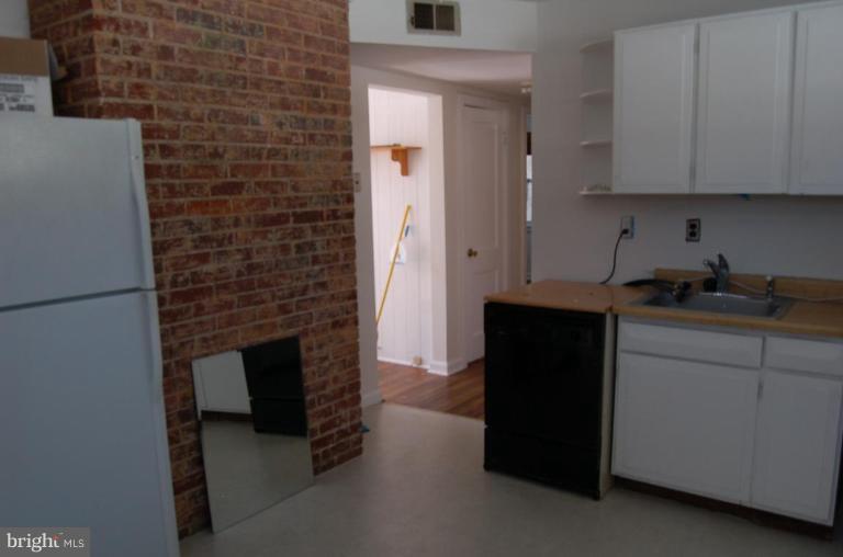 904 Robin Road Silver Spring, MD 20901 - Photo 6 of 10 a kitchen with a cabinets and a stove
