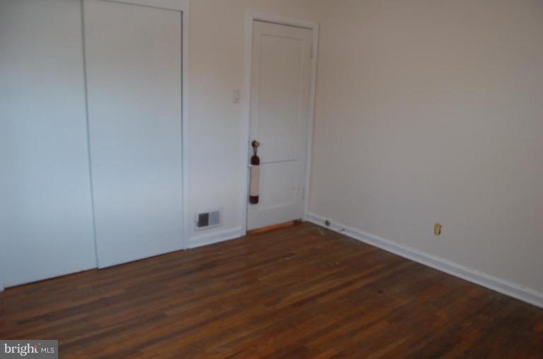 904 Robin Road Silver Spring, MD 20901 - Photo 9 of 10 a view of empty room with wooden floor