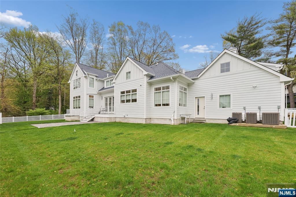 31 Engleside Street Cresskill, NJ 07626 - Photo 41 of 49 a view of a house with a big yard and large trees