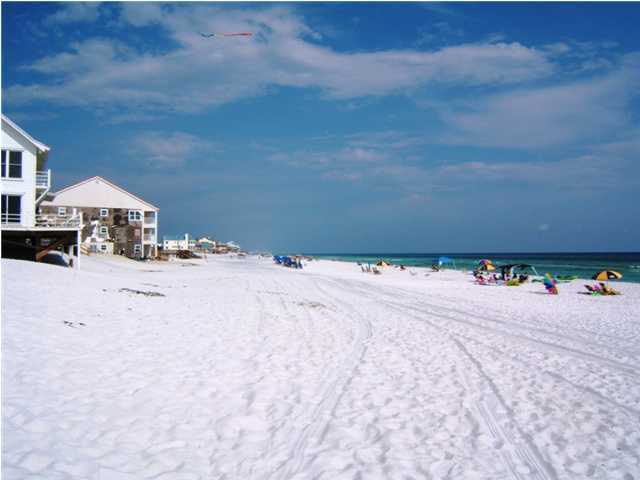 665 Eastern Lake Road Santa Rosa Beach, FL 32459 - Photo 2 of 11 a view of the ocean and a houses
