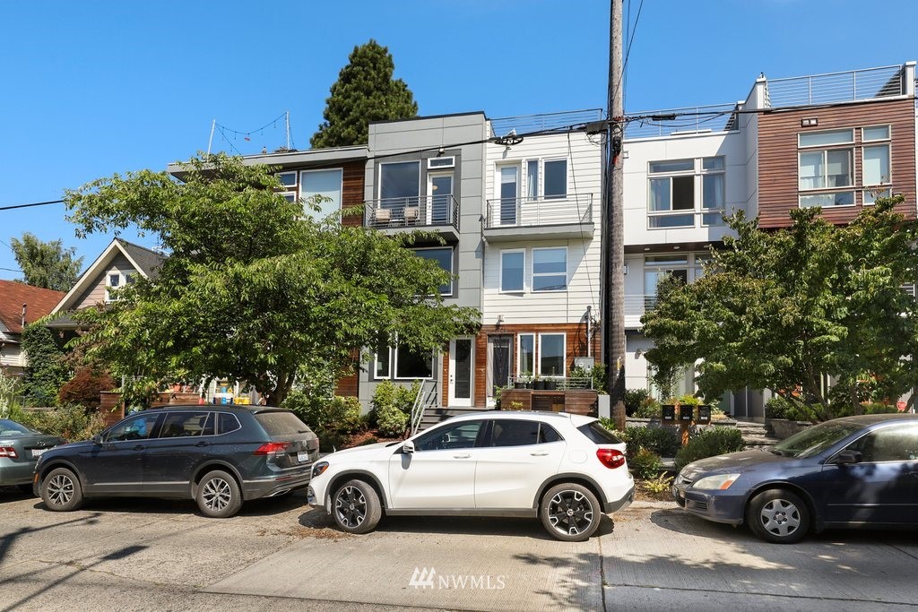 1730 Northwest 60th Street Seattle, WA 98107 - Photo 2 of 25 a view of a cars park in front of a house