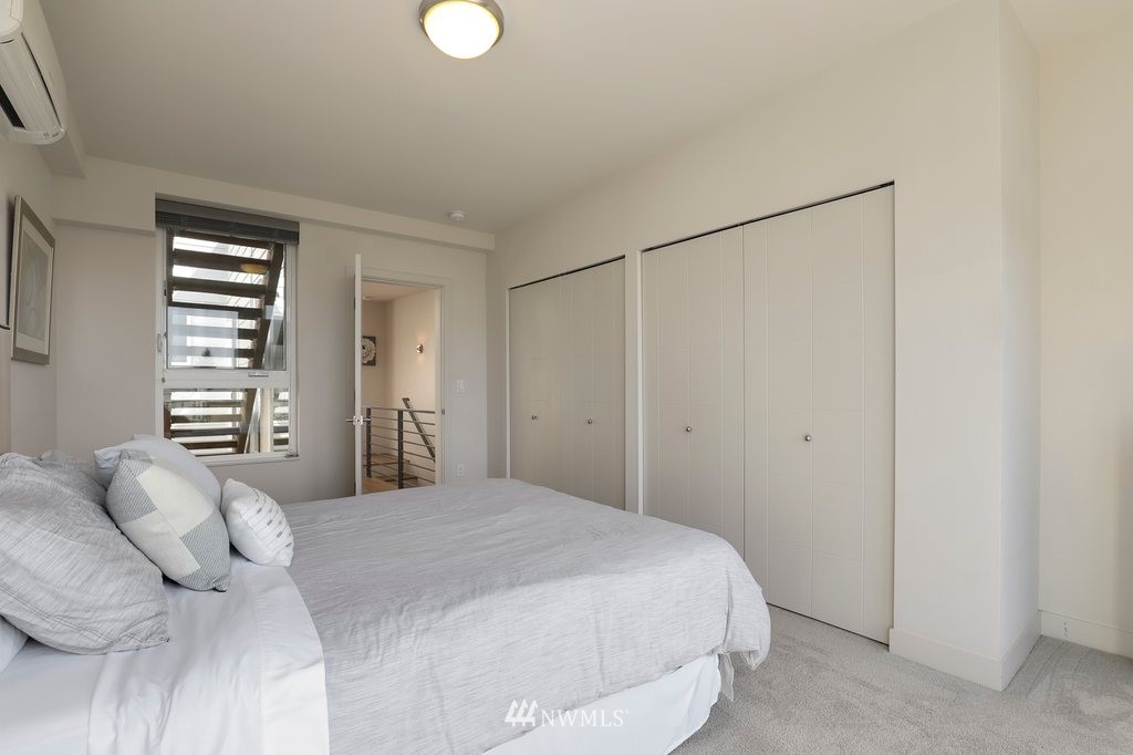 1730 Northwest 60th Street Seattle, WA 98107 - Photo 18 of 25 a bedroom with a bed and a window