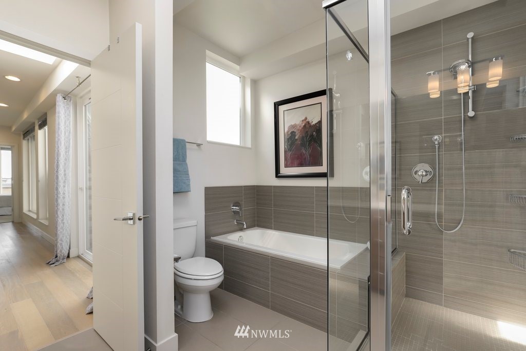 1730 Northwest 60th Street Seattle, WA 98107 - Photo 19 of 25 a bathroom with a toilet tub shower and view
