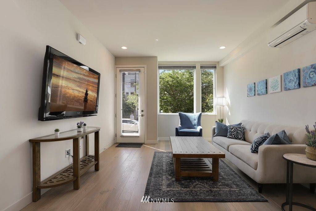 1730 Northwest 60th Street Seattle, WA 98107 - Photo 3 of 25 a living room with furniture and a flat screen tv