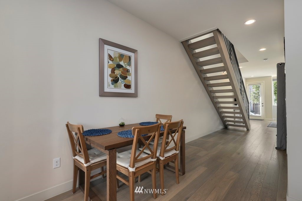 1730 Northwest 60th Street Seattle, WA 98107 - Photo 6 of 25 a view of a dining room with furniture and wooden floor