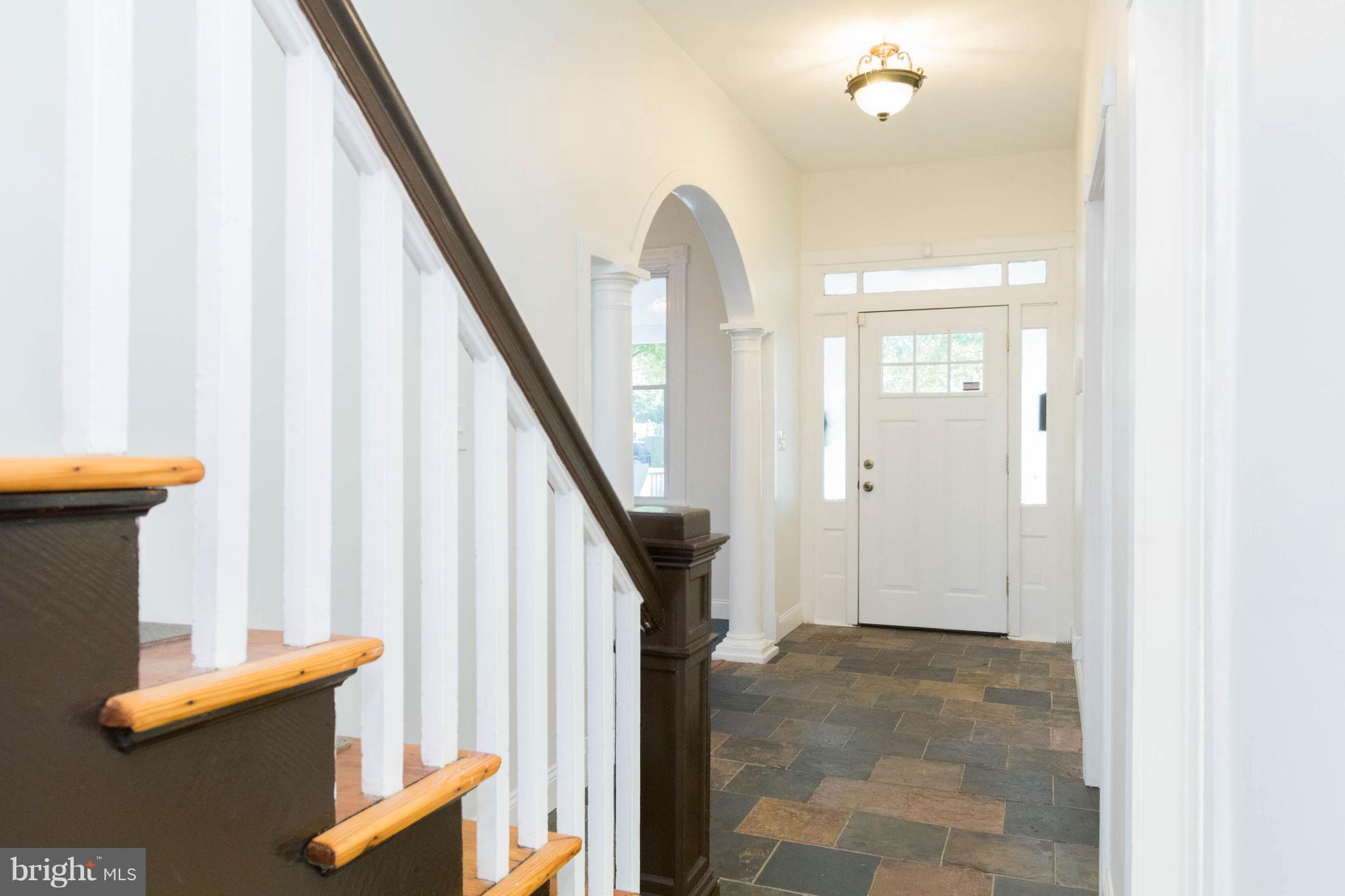 5318 Catalpha Road Baltimore, MD 21214 - Photo 13 of 27 Roomy Foyer with Stairs to Master Suite