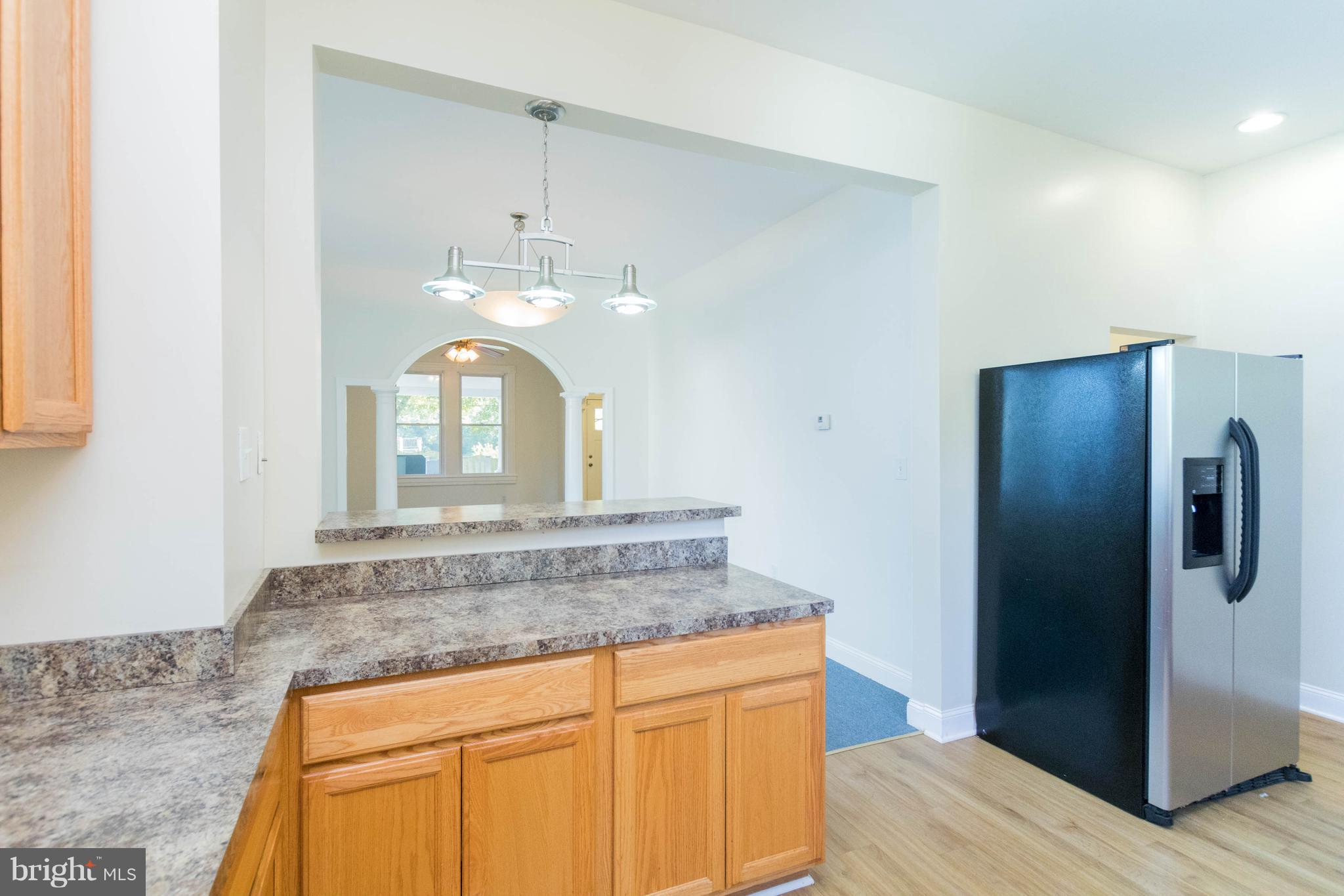 5318 Catalpha Road Baltimore, MD 21214 - Photo 6 of 27 Kitchen is Open to Dining Room