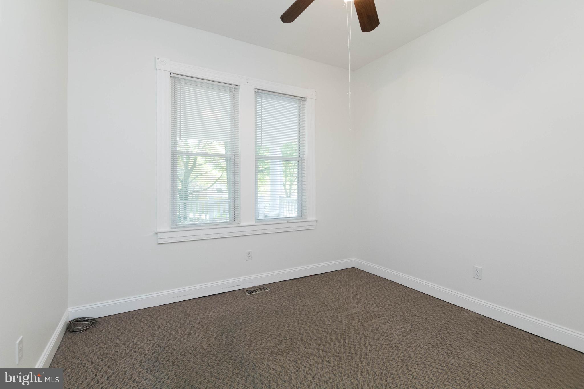 5318 Catalpha Road Baltimore, MD 21214 - Photo 9 of 27 Bedroom #1 - Two Windows & High Ceilings