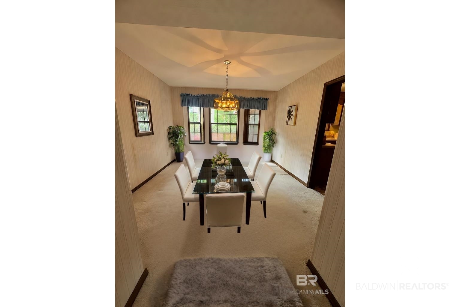 2240 Perdido Circle Lillian, AL 36549 - Photo 7 of 42 Carpeted dining room featuring a chandelier