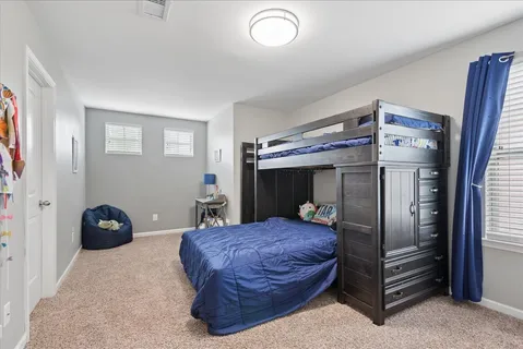 a bedroom with a bed and a closet