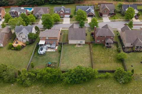 an aerial view of a house with a garden