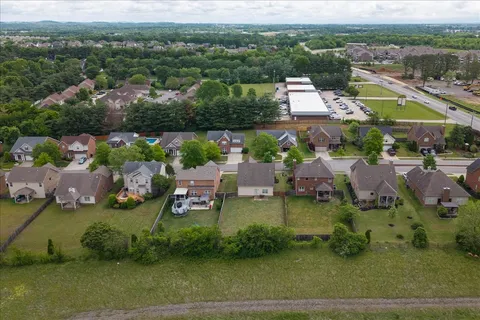 an aerial view of a house with a garden