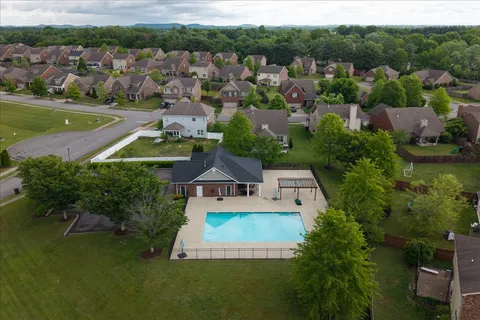 an aerial view of a house with a garden