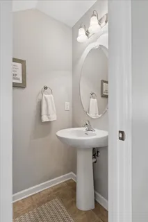 a bathroom with a sink and mirror