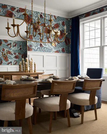 a dining room with furniture and window