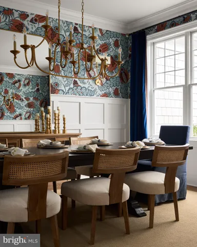 a dining room with furniture and window