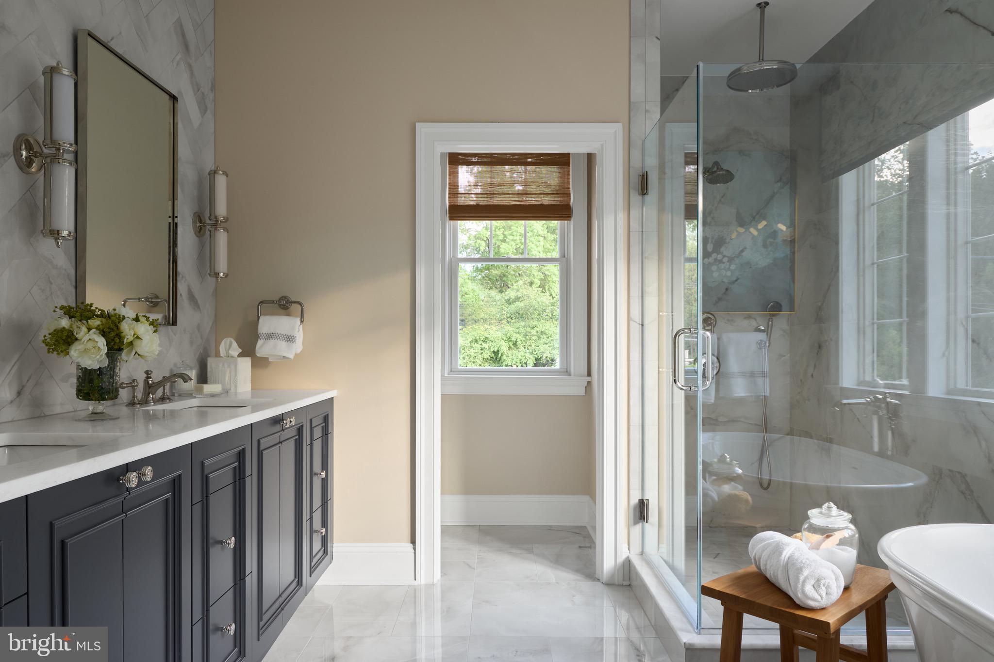 1052 Eagle Road Wayne, PA 19087 - Photo 15 of 18 a bathroom with a granite countertop sink a toilet and shower