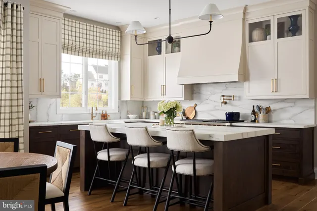 a kitchen with a table chairs stove and cabinets