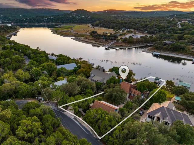 an aerial view of house with outdoor space and river