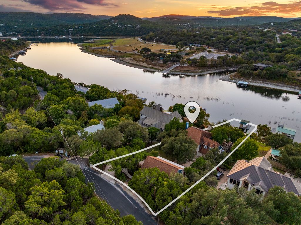 an aerial view of house with outdoor space and river