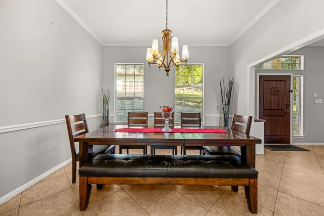 a view of a dining room with furniture and window