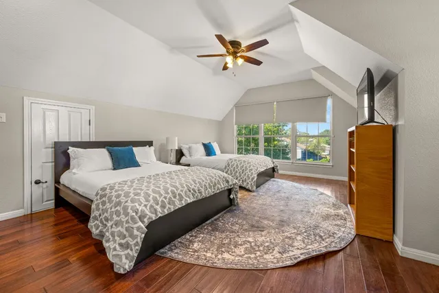 a living room with a bed furniture and a window