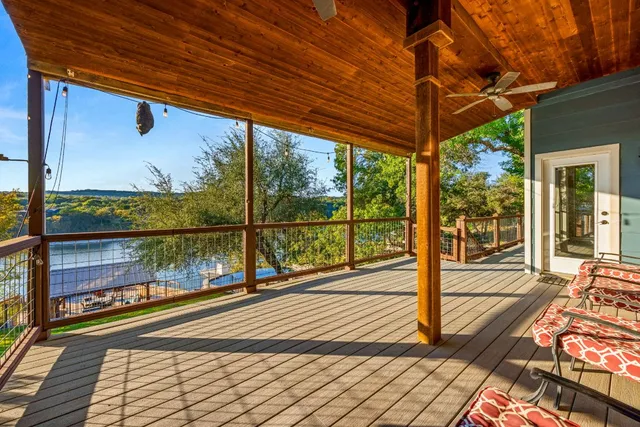 a view of a balcony with wooden floor
