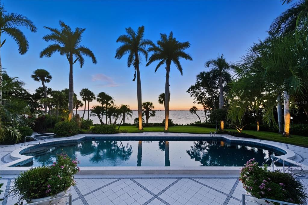 3315 Bay Shore Road Sarasota, FL 34234 - Photo 78 of 96 a view of a lake with a palm tree