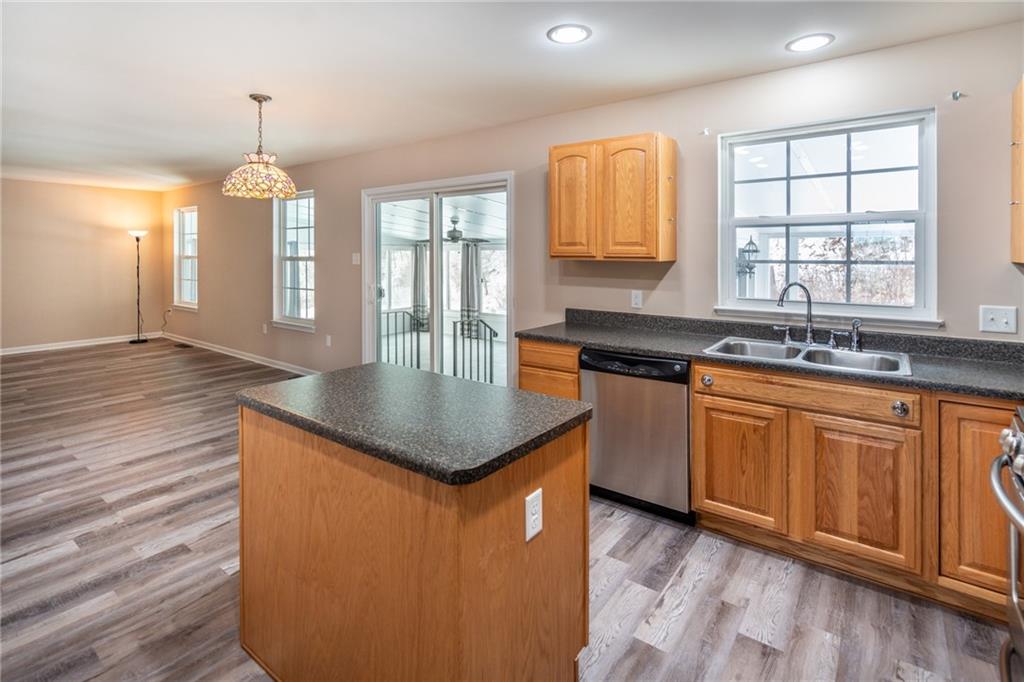 500 Walnut Drive McKees Rocks, PA 15136 - Photo 16 of 40 a kitchen with stainless steel appliances granite countertop a sink a stove cabinets counter space and windows