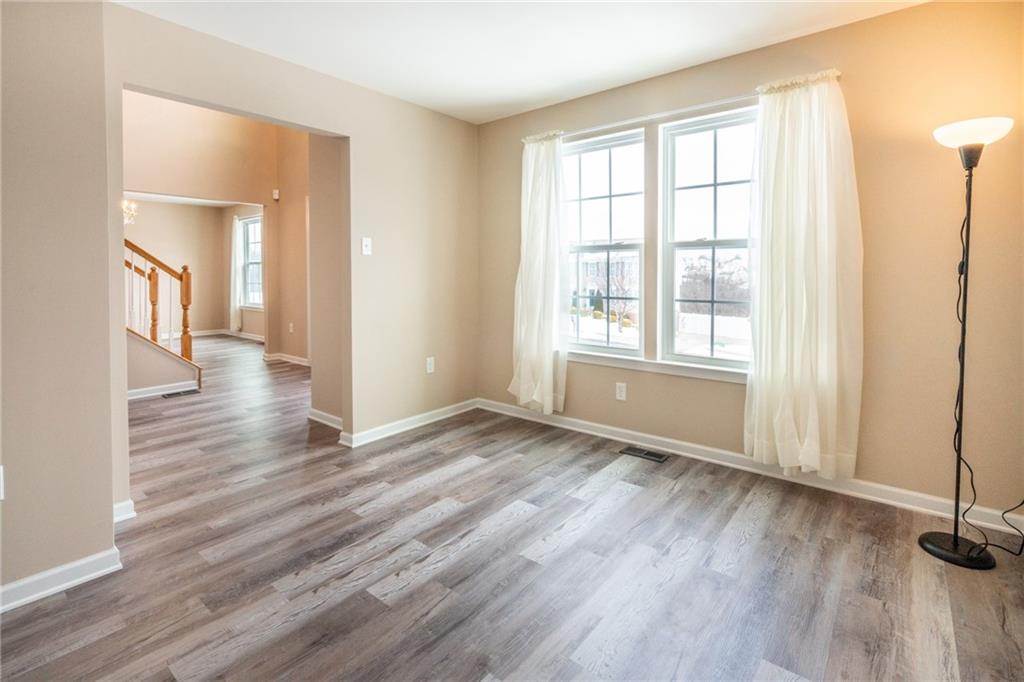 500 Walnut Drive McKees Rocks, PA 15136 - Photo 9 of 40 an empty room with wooden floor and windows